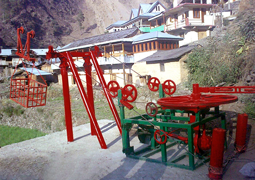 Mountain-Based Energy Infrastructure setup with cable-driven machinery installed in a remote mountain village, supporting local energy needs